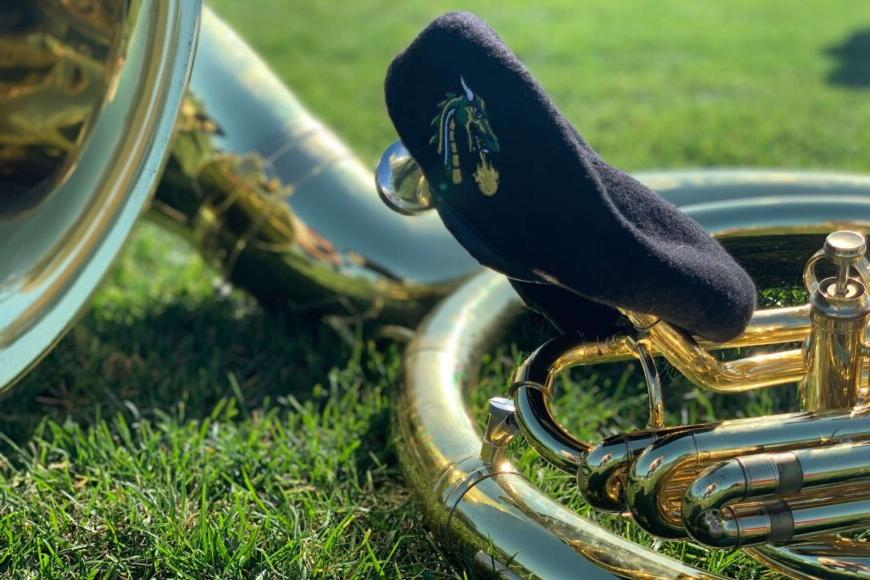 beret and brass instrument